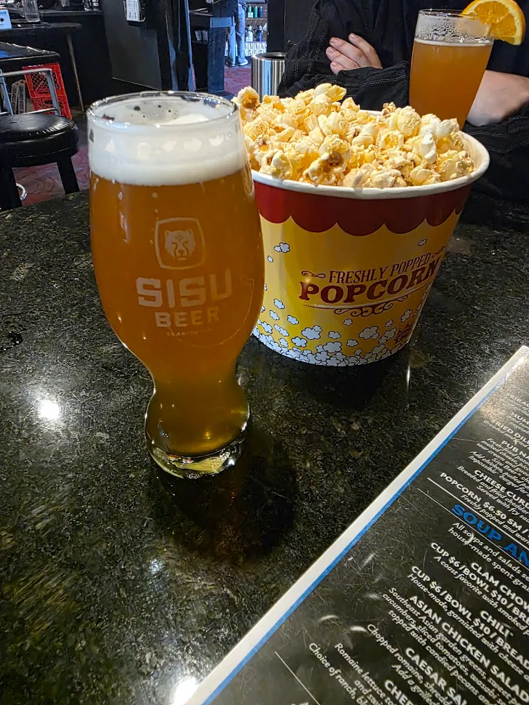Sisu beer and popcorn Pint of Sisu beer and a tub of theater popcorn at the Seaside taproom