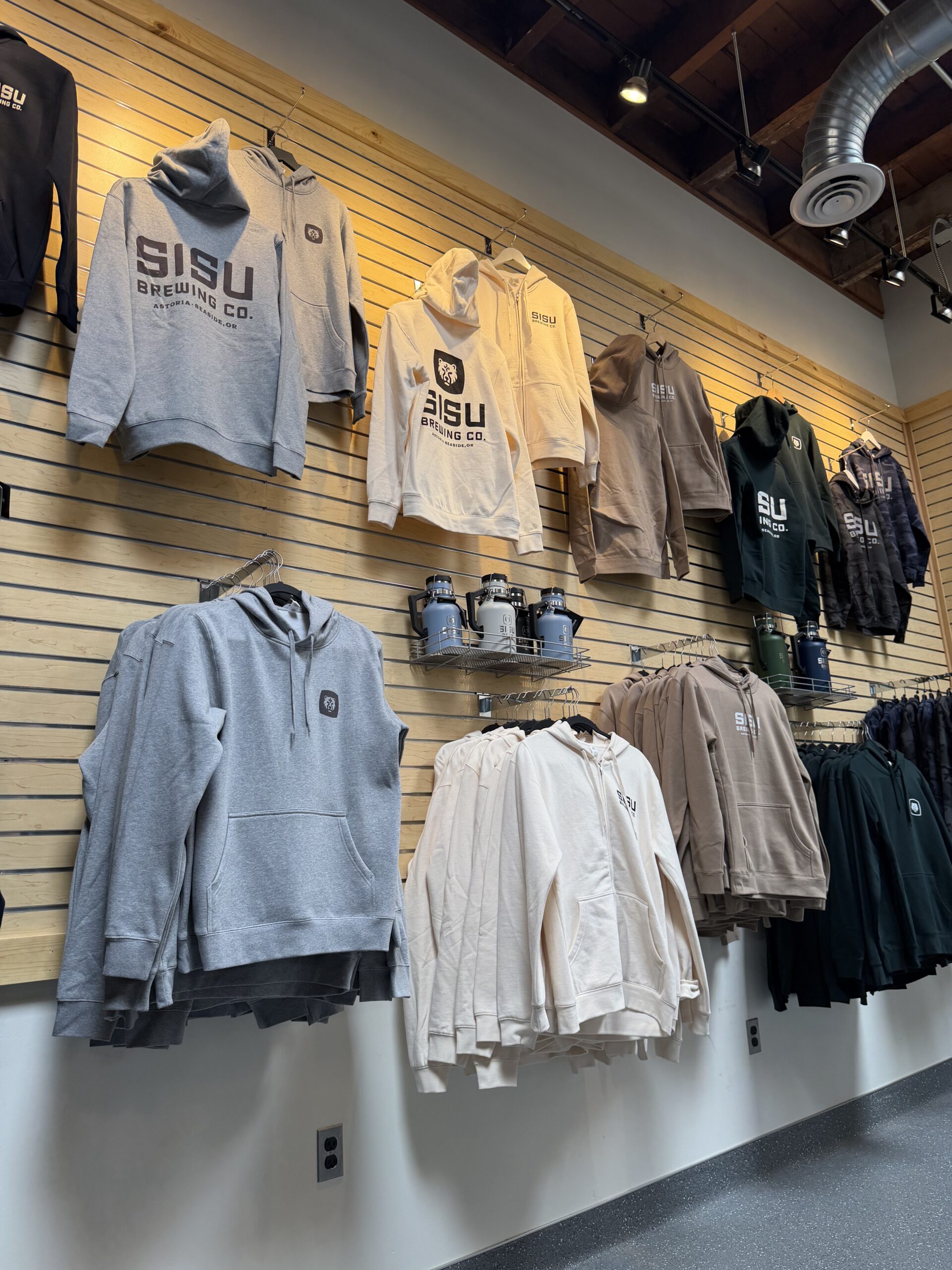 Sisu Brewing Co hoodies Wall of Sisu Brewing Co hoodies in grey, cream, tan, forest green, and camo